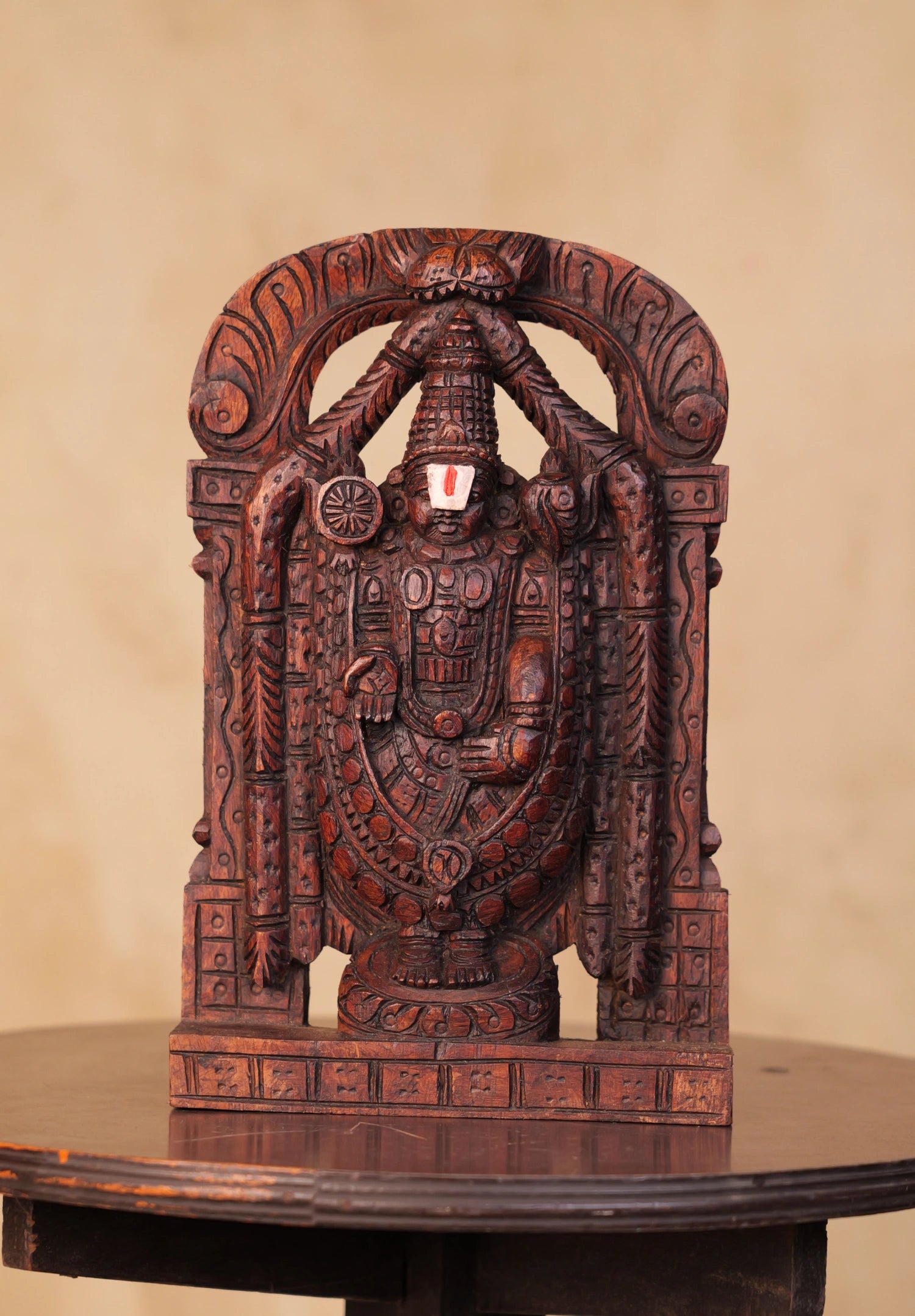 Hand-carved 1 ft wooden Tirupati Balaji statue with rich detailing and a traditional finish