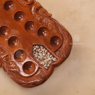 Hand Carved Teakwood Pallanguli Board with Peacock Motif – Traditional Mancala Game
