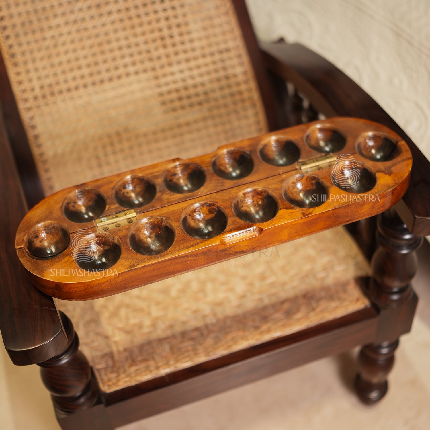 Handcrafted Mahogany Oval Folding Pallanguzhi (14 Pits) with Tribal Carvings