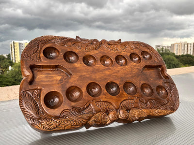 Hand Carved Teakwood Pallanguli Board with Peacock Motif – Traditional Mancala Game