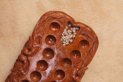 Hand Carved Teakwood Pallanguli Board with Peacock Motif – Traditional Mancala Game