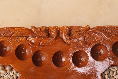 Hand Carved Teakwood Pallanguli Board with Peacock Motif – Traditional Mancala Game