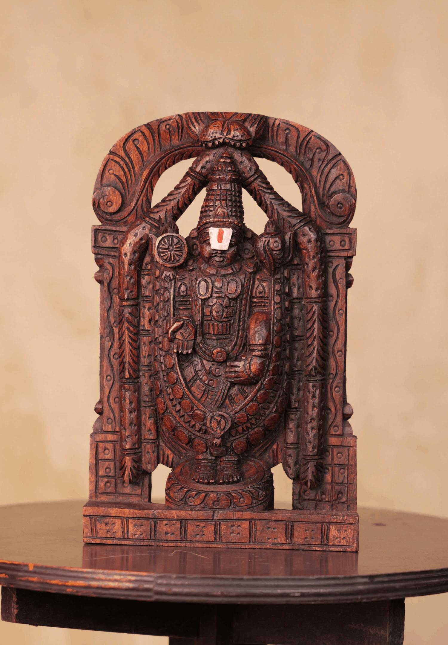 Hand-carved 1 ft wooden Tirupati Balaji statue with rich detailing and a traditional finish